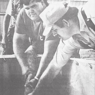30 YEARS AGO A MANUAL APPROACH is used here to fill the portable tank during fire training exercises Clinton firemen Robert McDown (center) and Barry DeHart hold the filler hose in place. At back is Arapaho Fire Chief Jeff Barrick. CLINTON’S HISTORY 10, 20 AND 30 YEARS AGO
