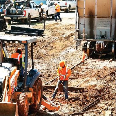 CDN | Robert S. Bryan Craig Wolfe , superintendent of equipment for the Farmrail System, mans a shovel as repairs are made to the trackbed at Bessie. Heavy rains and soggy soil impacted support for the tracks, forcing their closur Article Image Alt Text