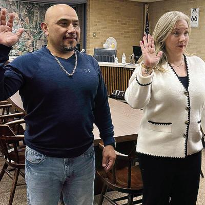 Ernesto Villanueva, left, and Erin Adams are sworn in to their new terms on the Clinton City Council before Tuesday night’s meeting. CDN | Courtesy photo