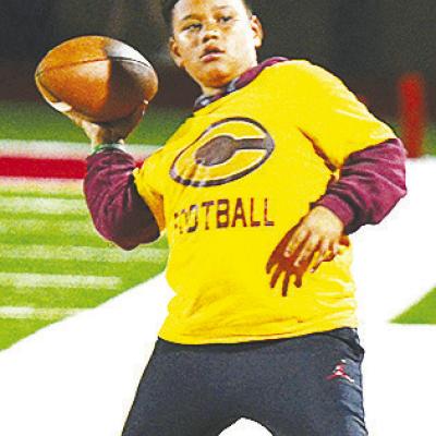 Kai Jefferson throws the football on the sideline during halftime of Clinton’s road game last week against Cache. CDN | Sam Goodwyn