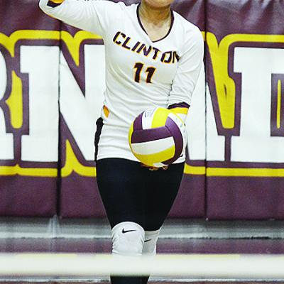 Clinton’s Karol Bonilla prepares to serve the ball during the Lady Reds’ home game against Weatherford. CDN | Sam Goodwyn