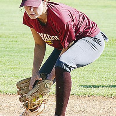 Clinton’s Reece Giblet collects the ball hit toward her before she throws it to first during practice Thursday. CDN | Sam Goodwyn