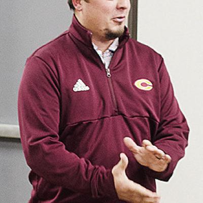 Newly hired Clinton head football coach Trevor Powers speaks with the Board of Education after being approved to take over the team during Monday’s meeting at the board office. CDN | Sam Goodwyn
