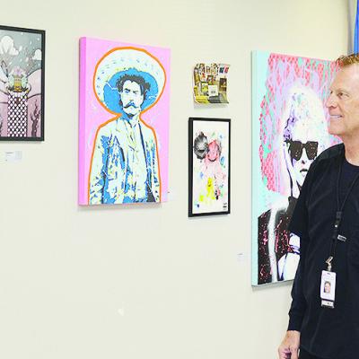 Pharmacist Cris Hickerson admires some of the new art installed at Clinton Regional Hospital. CDN | Micah Ashcraft