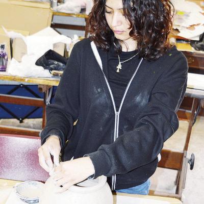 CHS senior Jessica Garcia puts the finishing touches on her clay project in Joy Badillo’s Art 3 class. CDN | Michael Maresh CHS senior Jessica Garcia puts the finishing touches on her clay project in Joy Badillo’s Art 3 class. CDN | Michael Maresh