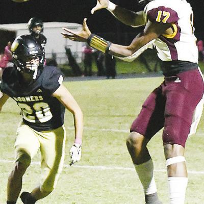 Clinton’s No. 17 DJ Lister focuses on the ball as he catches it before a defender gets to him during the Red Tornadoes’ road win over Woodward. CDN | John Kinsey