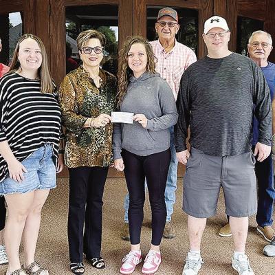 From left, Debbie Avery, Susan Klein, Natalie Vowell, Canda Dupree, Jennifer Lee, Sam Shelton, Brad McBride, Troy Lee and Trey Arney after the Cumberland Presbyterian Women’s group recently donated $500 to the Mission House Food pantry from the proceeds
