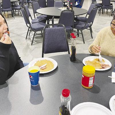 At the Kiwanis Club’s 77th annual Pancake Day, hundreds of people attended. Olivia Boomershine, at left, and Anelyz Martinez were among the 200 people who had attended through the early afternoon. CDN | Michael Maresh Enjoying pancakes