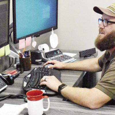 Devin Martin works at his desk at Farmrail’s Betke Station at 150 E. Gary Blvd. CDN | Caleb Blanchard Martin embraces new role with Farmrail