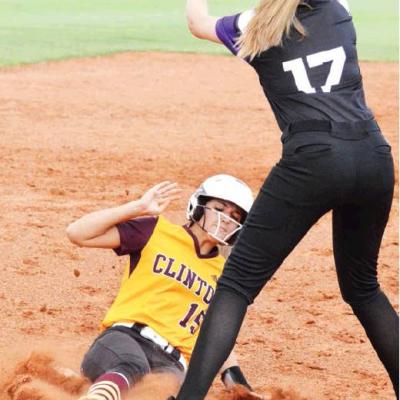CDN | Collin Wieder Clinton catcher Kennedy Meacham, No. 15, slides safely into third base during Monday’s game versus Bethany. Article Image Alt Text