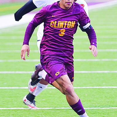 Clinton’s Carlos De La Fuente beats a Douglass defender to the ball during the Red Tornadoes win over the Trojans at home. CDN | Sam Goodwyn