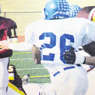Clinton running back Willie Ford, No. 10, follows a block by teammate Ryan Hall. CDN | File Photo