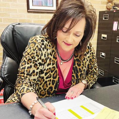 Debra Blanchard goes over a financial report for the City of Clinton. Blanchard oversees finances as treasurer for City of Clinton