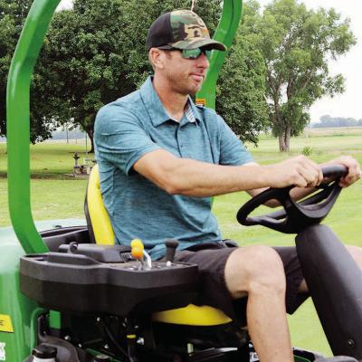 Landon Littke, Riverside Golf Course superintendent, drives to pick up driving range balls at the golf course. CDN | Elisha Rangel Littke changes appearance, face of Riverside Golf Course