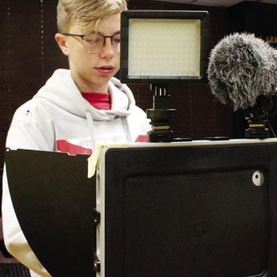 Judd Hall readies himself to make a report for CMS TV. The project is produced entirely by the middle school students. CDN | Tate Bryson/Whirlwind News CMS TV students put in time for broadcasts