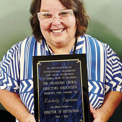 Clinton Middle and High School Choir Director Kimberly Duerksen with the award for the OkCDA 2025 Director of Distinction. CDN | Courtesy photo