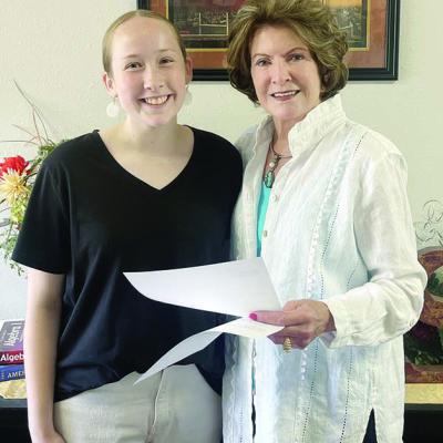 Anna Christie, left, receives the Jeannie Walker Memorial Scholarship from Cheryl Lowry, chairman of the scholarship committee for P.E.O. Chapter FR. CDN | Courtesy photo CHS graduate recieves scholarship from local P.E.O. group