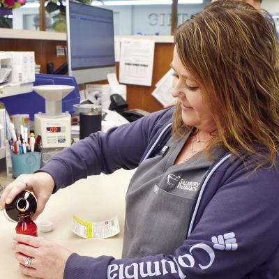 Misty Jones fills a prescription at Salisbury Pharmacy