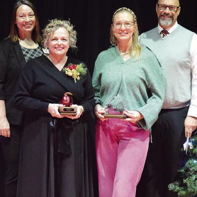 From left, Clinton Public Schools Asst. Supt. Melissa Knabe, CPS Teacher of the Year recipient Ginger England, CPS Support Staff of the Year recipient Sheffield Southall, and CPS Supt. Nathan Meget stand together during the Clinton Teacher of the Year rec