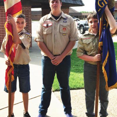 Boy Scouts carry the colors