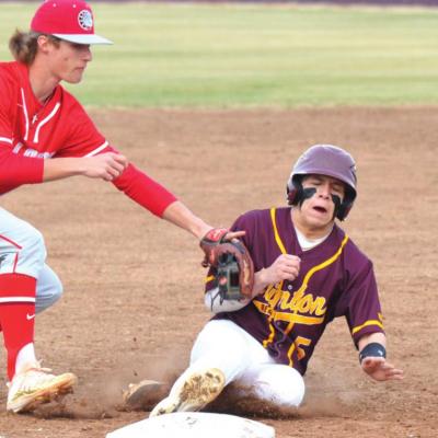 Late miscues cost Reds in opener