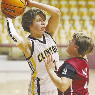 Clinton Middle School’s Braxton Garrison keeps the ball away from a Weatherford defender during the Whirlwinds’ eighthgrade game against the Eagles in the Tornado Dome. CDN |Steve Wheeler