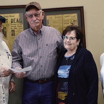 Mike Perkins, left, presents a check to Robert Beeson, who stands next to Connie Burden and Myrna Perkins. CDN | Hope King Mike Perkins, left, presents a check to Robert Beeson, who stands next to Connie Burden and Myrna Perkins. CDN | Hope King