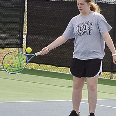 Clinton’s Sami Hammans returns the serve during tennis practice. CDN | Sam Goodwyn