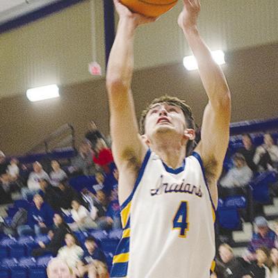 No. 4 Kaden Waldrop fights through a defender for the layup in A-B’s game against Hammon. CDN | Sam Goodwyn