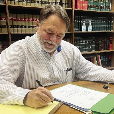 Richard Phillips looks over paperwork for an upcoming trial. CDN | Emily Stephens Richard Phillips looks over paperwork for an upcoming trial. CDN | Emily Stephens