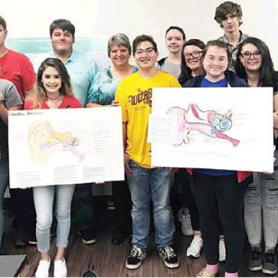 Speaker lectures on cochlear implants