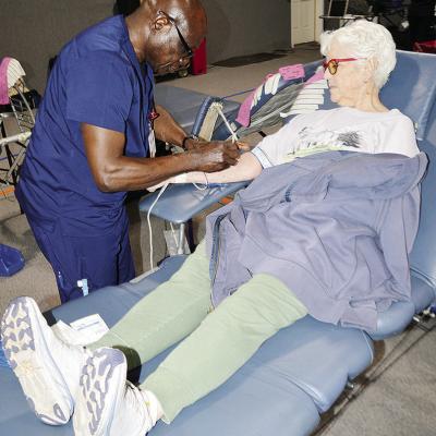 Clarkson Obasi, left, with the Oklahoma Blood Institute, draws blood from the arm of Jeanie Haney Tuesday afternoon at the Clinton Community Blood Drive at the First Christian Church’s Family Life Center. CDN | Michael Maresh Clarkson Obasi, left, with the Oklahoma Blood Institute, draws blood from the arm of Jeanie Haney Tuesday afternoon at the Clinton Community Blood Drive at the First Christian Church’s Family Life Center. CDN | Michael Maresh