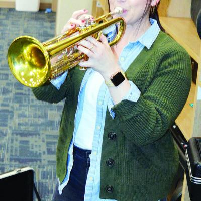 Corn Bible Academy music teacher Briana Bull plays the trumpet. Bull assisted former CBA music teacher Charles Regier, and took over the program when her mentor left for another position in the school. CDN | Michael Maresh Corn Bible Academy music teacher Briana Bull plays the trumpet. Bull assisted former CBA music teacher Charles Regier, and took over the program when her mentor left for another position in the school. CDN | Michael Maresh