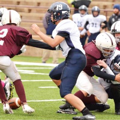 CDN | Collin Wieder Brady Chittum, middle, and Race Elliott, right, hit an El Reno ball carrier and force a fumble. Luke Cameron, left, prepares to dive on it. Article Image Alt Text