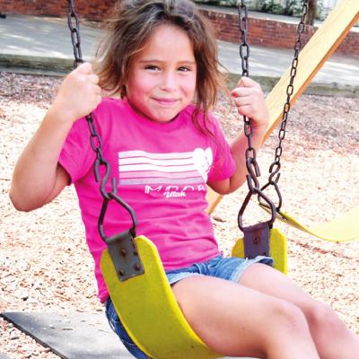 Soft smiles on the swingset