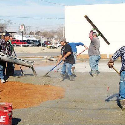 CDN | Robert S. Bryan Light rains Friday forced workers at the new Clinton Veterans Clinic indoors, but Thursday employees of Jesse Musick Concrete were busy finishing the north parking lot for the facility. The east one, which fr Rain or shine, new clinic looking fine