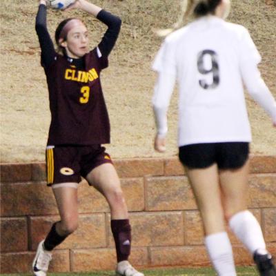 Courtney Heerwald prepares to make a throw-in during a home game this season. CDN | Emily Stephens Soccer teams advance to semis