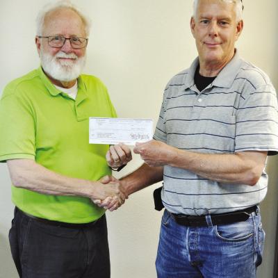 It’s not every day a check for $6,255,272 is written, much less delivered, but that was the case Wednesday when Clinton City Manager Robert Johnston, left, handed a check for that amount representing the City of Clinton’s share of the Exit 65 Project 