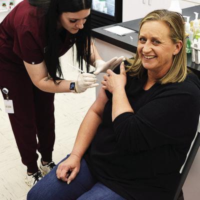 Salisbury Pharmacy technician Chloe Cannaley prepares to give a flu shot to Becky Murphy. CDN | Michael Maresh Salisbury Pharmacy technician Chloe Cannaley prepares to give a flu shot to Becky Murphy. CDN | Michael Maresh