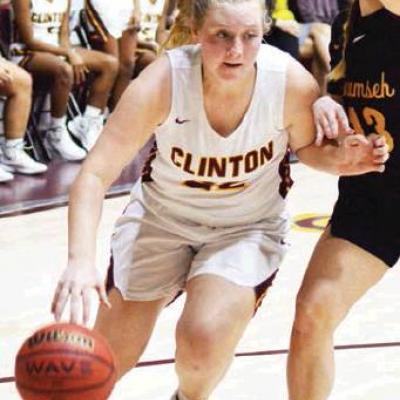 CDN | Collin Wieder Clinton senior Kayde Whitney dribbles by a Tecumseh player in last year’s district title. She returns as the team’s second-leading scorer. Lady Reds begin season with more depth on the roster