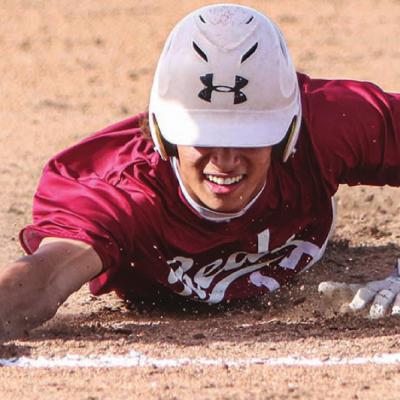 Clinton’s DeAndre Fanisher dives back to first base during the 9-8 setback at home versus Elk City Tuesday evening. Fanisher went 2-for-4 with one RBI. CDN |Adam Ewing Reds drop series with Elk City