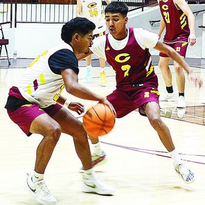 Clinton’s Adam Flores, left, dribbles around teammate Ronnie Redshin during a recent practice in the Tornado Dome. CDN |Sam Goodwyn Clinton’s Adam Flores, left, dribbles around teammate Ronnie Redshin during a recent practice in the Tornado Dome. CDN |Sam Goodwyn