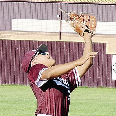 Clinton’s Jesus Gutierrez focuses on the ball as he goes to catch the pop fly during the Reds’ game against Weatherford. CDN | Sam Goodwyn