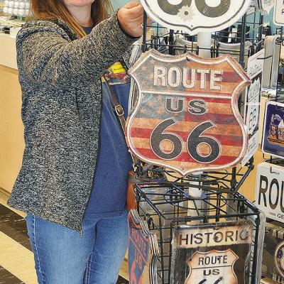 Kimberly Warner of Meers looks at the Route 66 signs Wednesday in the gift shop of the Oklahoma Route 66 Museum. CDN | Sam Goodwyn Kimberly Warner of Meers looks at the Route 66 signs Wednesday in the gift shop of the Oklahoma Route 66 Museum. CDN | Sam Goodwyn