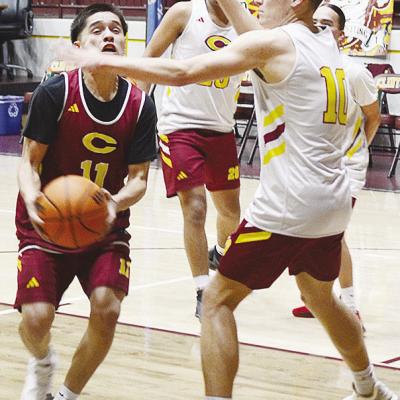 Clinton’s AJ Reynolds, left, fights through teammate Parker Adams on his way to the basket during practice in the Tornado Dome. CDN | Sam Goodwyn Clinton’s AJ Reynolds, left, fights through teammate Parker Adams on his way to the basket during practice in the Tornado Dome. CDN | Sam Goodwyn