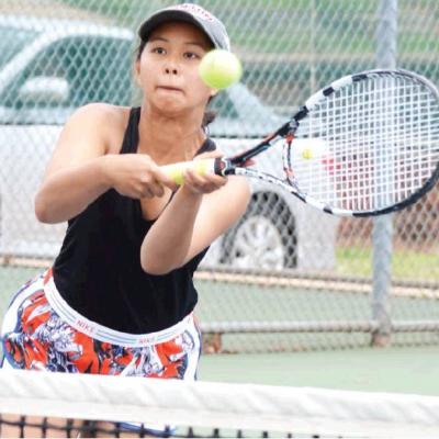 CDN | Collin Wieder Clinton junior tennis player Michelle Nguyen hits a return at the net, in the Route 66 Tournament, No. 2 doubles final. Article Image Alt Text