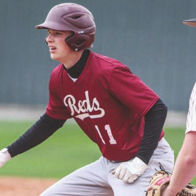 Jackson Crumley takes a lead at first base while Weatherford’s Kason Page holds him on. Crumley 3-for-4 with four RBIs in Clinton’s 16-6 win Monday evening. CDN | Adam Ewing Reds rout Eagles