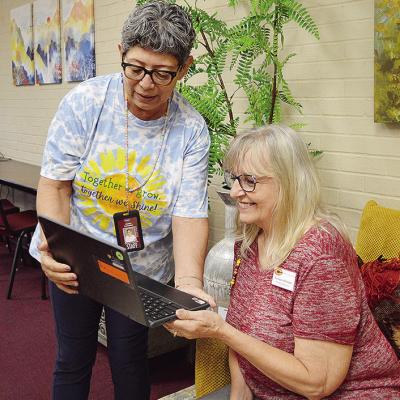 Juanita Carrizales, left, and Connie Hileman check a student’s information on a school Chromebook at the Southwest Elementary School front office. CDN | Micah Ashcraft Juanita Carrizales, left, and Connie Hileman check a student’s information on a school Chromebook at the Southwest Elementary School front office. CDN | Micah Ashcraft
