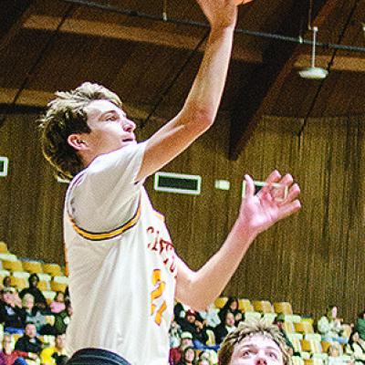 No. 21 Snider Dowdell shoots the ball after fighting to get past a Harrah defender during Clinton’s season-opening win over the Panthers Tuesday in the Tornado Dome. CDN | Sam Goodwyn