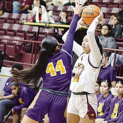 Clinton’s Ella Redshin looks for an open teammate during the Lady Reds’ game against Anadarko in the Tornado Dome. CDN | Sam Goodwyn